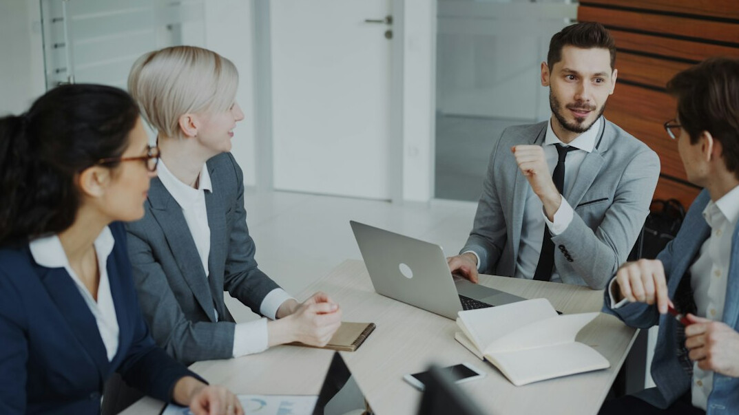 person discussing ideas in meeting