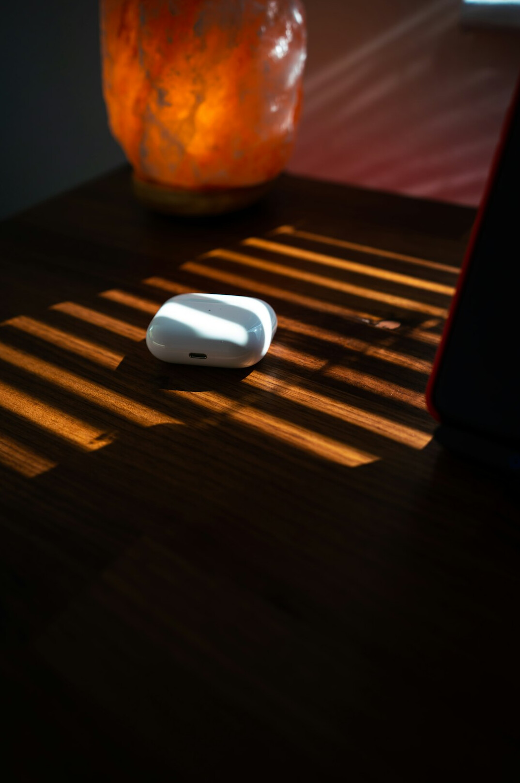 Quiet desk with notebook and laptop in warm light