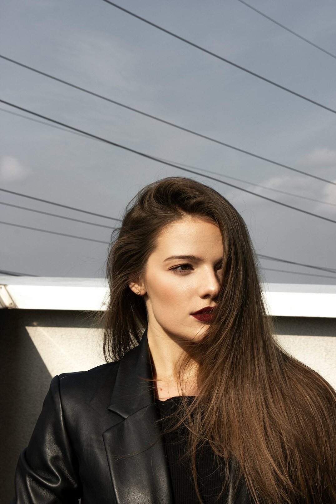 Portrait of a woman with shoulder-length hair in business attire